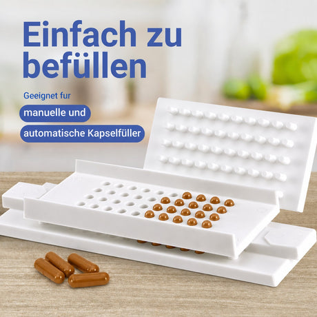 Kapselfüller mit befüllten karamellfarbenen Kapseln, die Kapseln sind geeignet für manuelle und automatische Befüllung