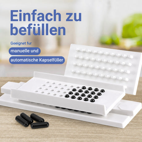 Kapselfüller mit schwarzen Kapseln, die Kapseln sind geeignet für manuelle und automatische Befüllung